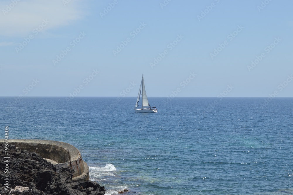 White boat in blue sea