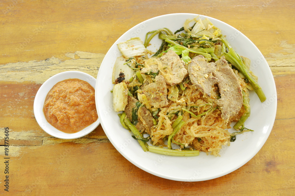 fried glass noodles with pork and vegetable on plate dipping sukiyaki sauce fried glass noodles with pork and vegetable on plate dipping sukiyaki sauce