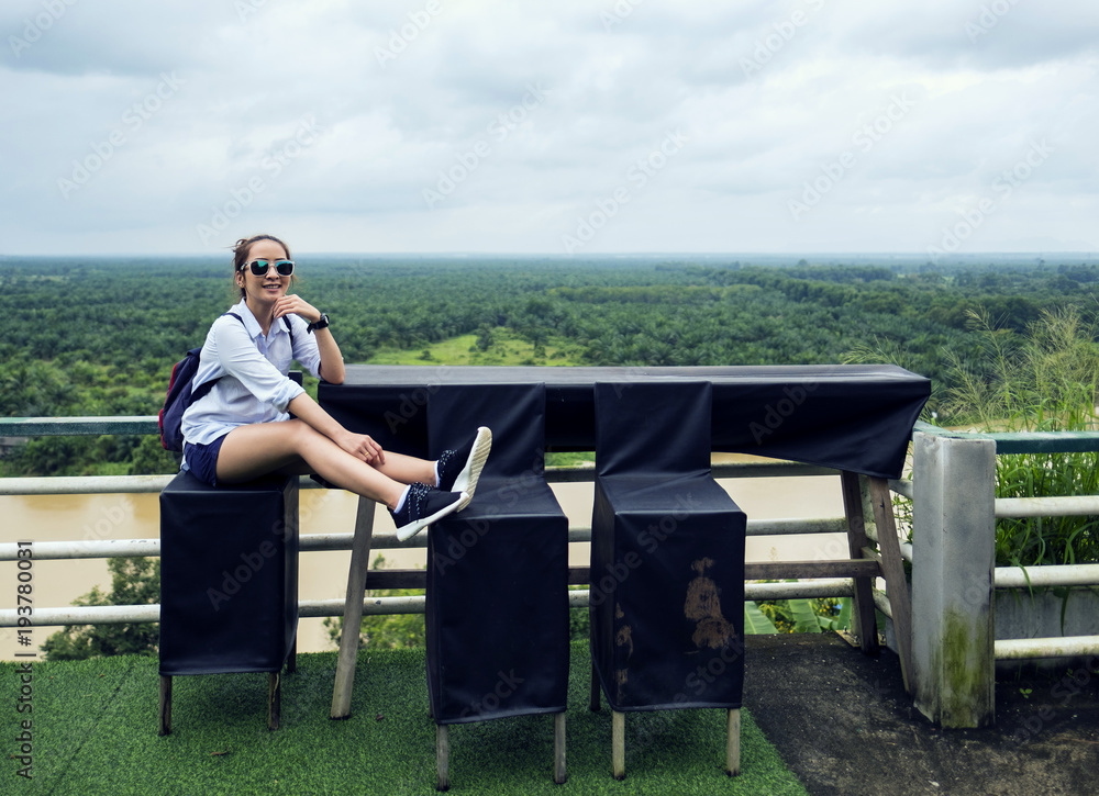 Traveler a girl sit on beautiful outdoor view point with sit relax in holiday happy time