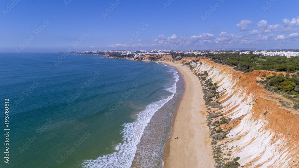 Aerial rocks and cliffs seascape shore view of famous Falesia beach, Algarve.