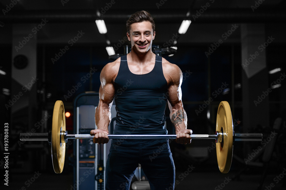 Handsome model young man workout in gym Handsome model young man workout in gym