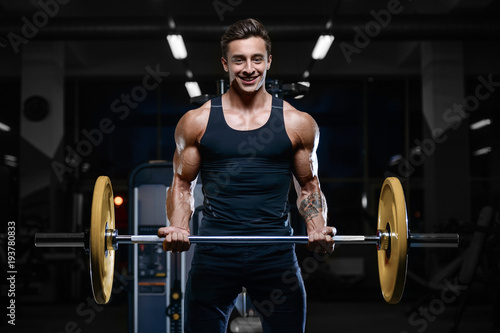 Handsome model young man workout in gym