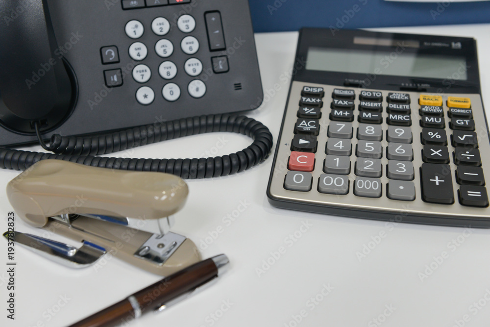 Office equipment with IP Phone, pen, stapler and calculator Office equipment with IP Phone, pen, stapler and calculator