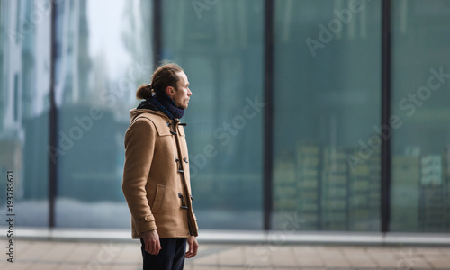 Confident businessman on cityscape in daylight