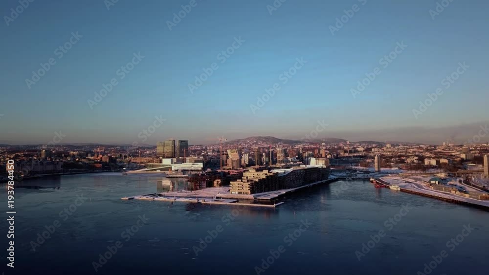Aerial crane shot of Lambda Munch museum, Opera and houses in Sorenga in Oslo, Norway in winter Aerial crane shot of Lambda Munch museum, Opera and houses in Sorenga in Oslo, Norway in winter