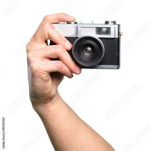 Hand holding Camera over isolated white background