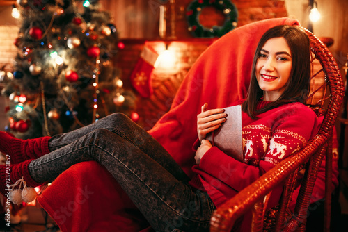 Young woman sitting on a chair  xmas celebration