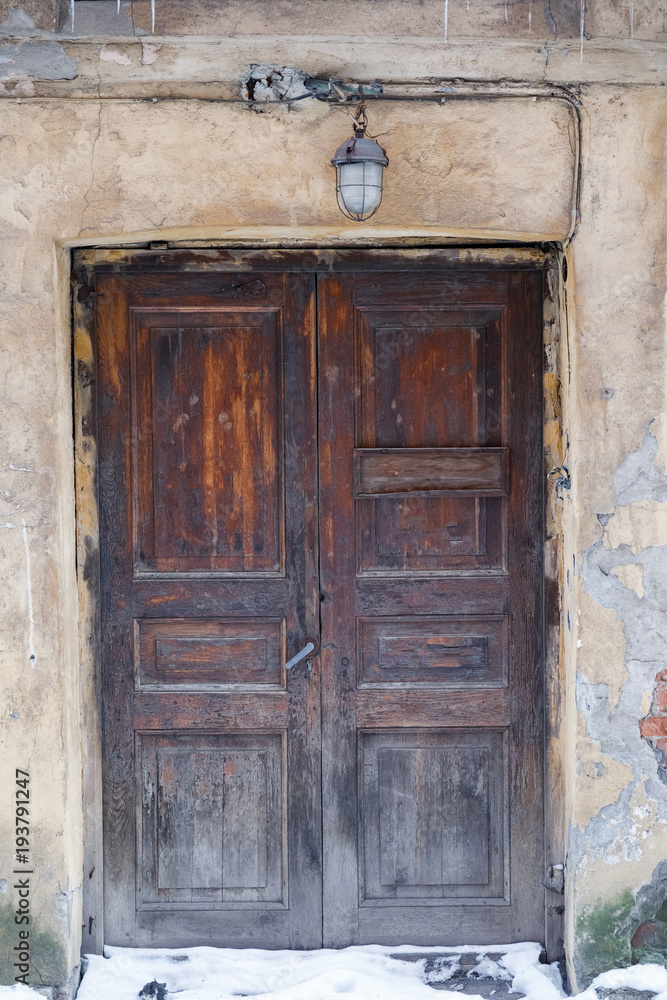 beautiful old wooden door with a visor