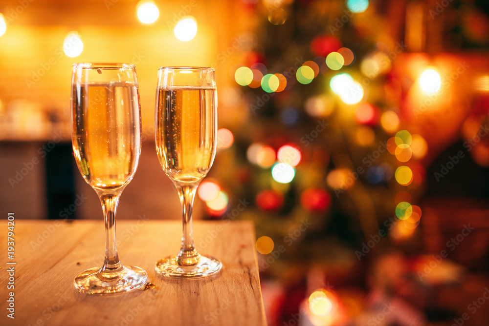 Two glasses with champagne, christmas decoration