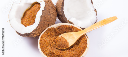 Coconut with coconut sugar isolated on white background.