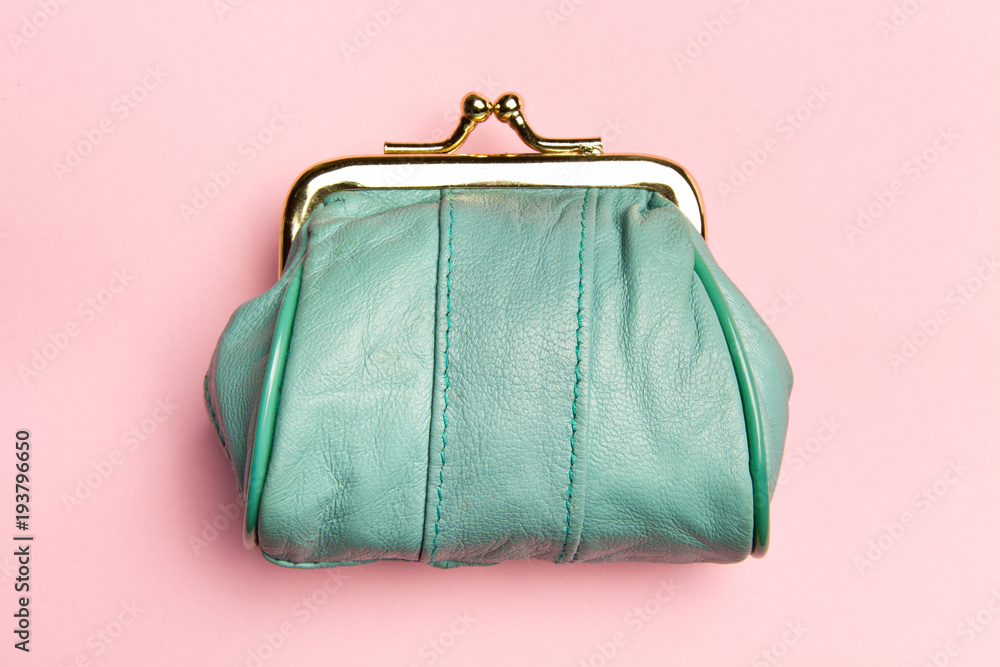 © Stanislau_V - Purse for coins.Wallet for change. Leather purse, purse on a pink background. Color of the trend.The concept of poverty