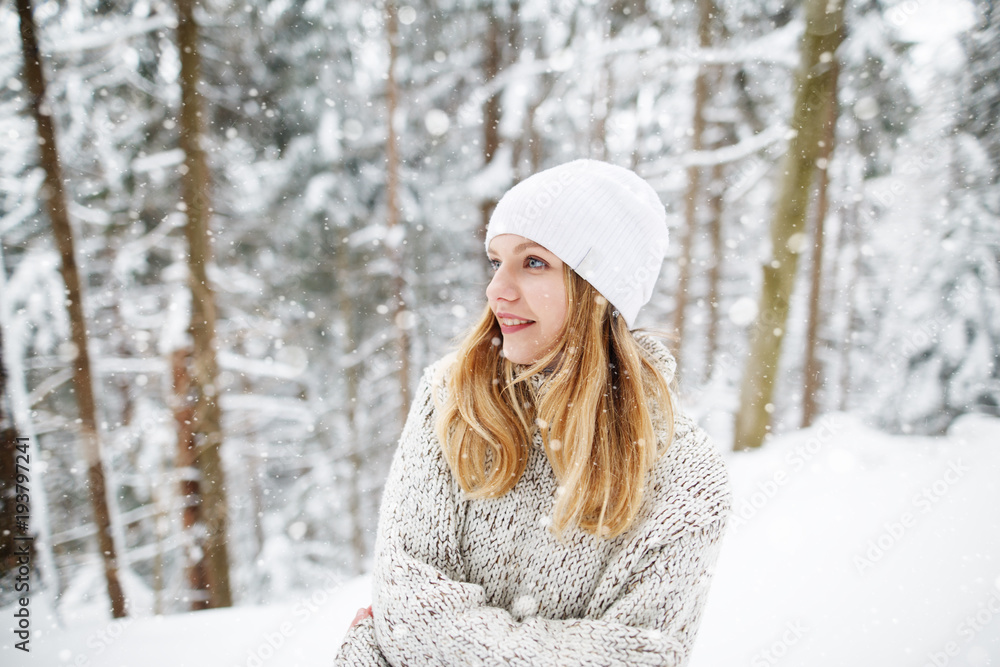 Beautiful winter portrait of young woman in the winter snowy scenery. Happy winter moments. Christmas Girl Beautiful winter portrait of young woman in the winter snowy scenery. Happy winter moments. Christmas Girl