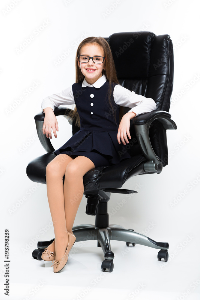 Little girl sitting in chair dressed as a businesswoman Little girl sitting in chair dressed as a businesswoman