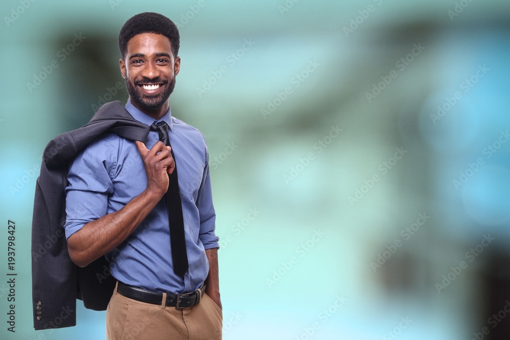 Young businessman in front of a blurred background Young businessman in front of a blurred background