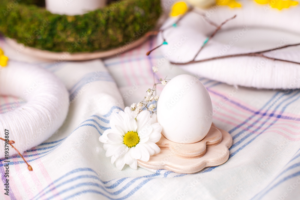 egg in a wooden stand with floral elements - elements of the Easter festive table, serving option egg in a wooden stand with floral elements - elements of the Easter festive table, serving option