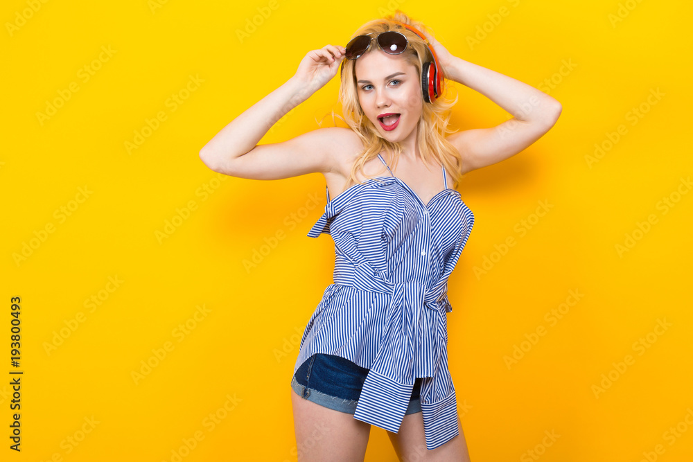 Girl in blouse with headphones and sunglasses Girl in blouse with headphones and sunglasses