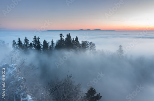 Misty mountain forest landscape in the morning, Poland © tomeyk