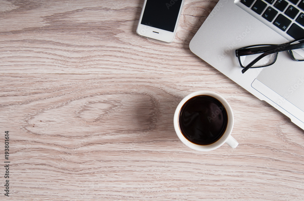 Notebook with hot coffee on wood table Notebook with hot coffee on wood table