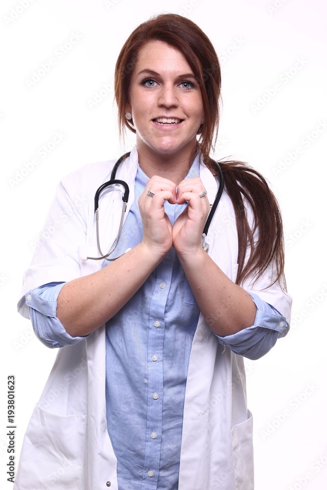 A nurse in front of a white background A nurse in front of a white background