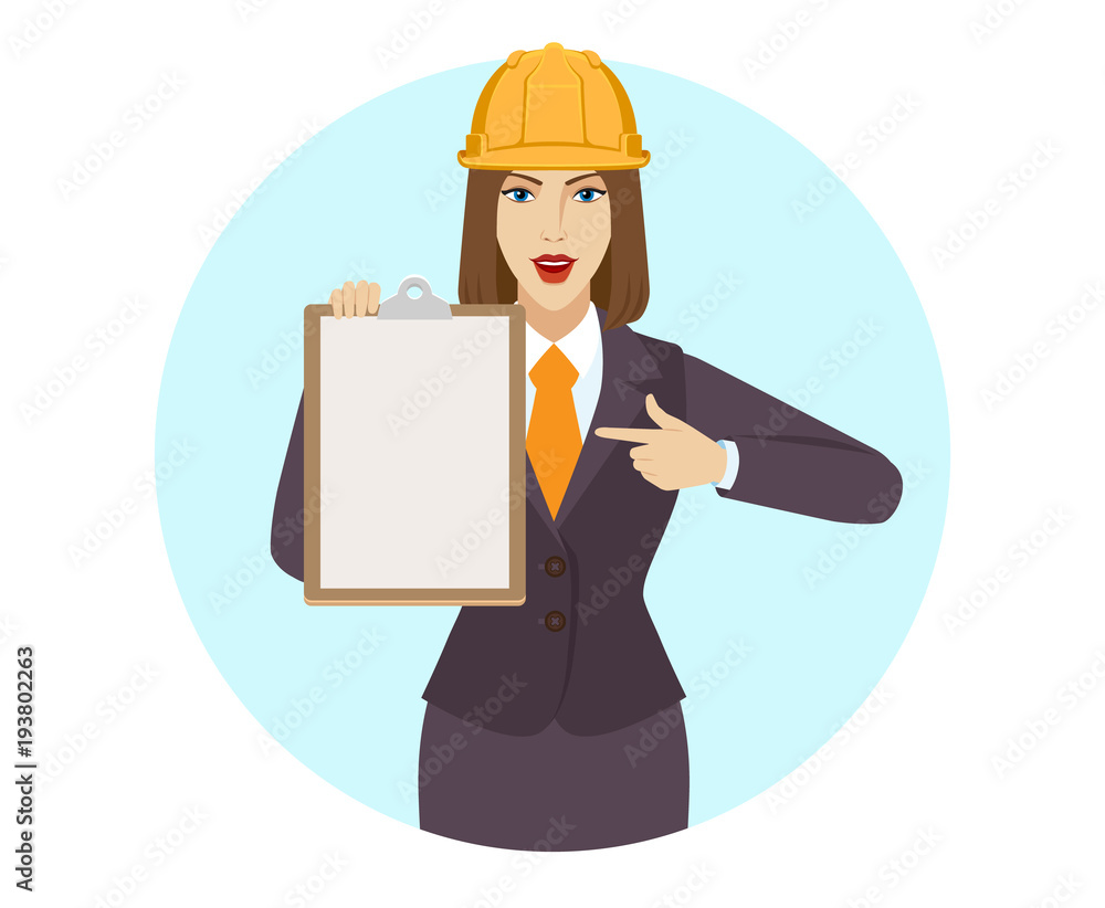 Businesswoman in construction helmet pointing on clipboard Businesswoman in construction helmet pointing on clipboard