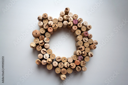 Wine corks wreath abstract composition isolated on white background from a high angle view