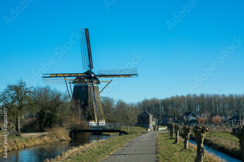 Historical wind mill in a dutch rural landscape