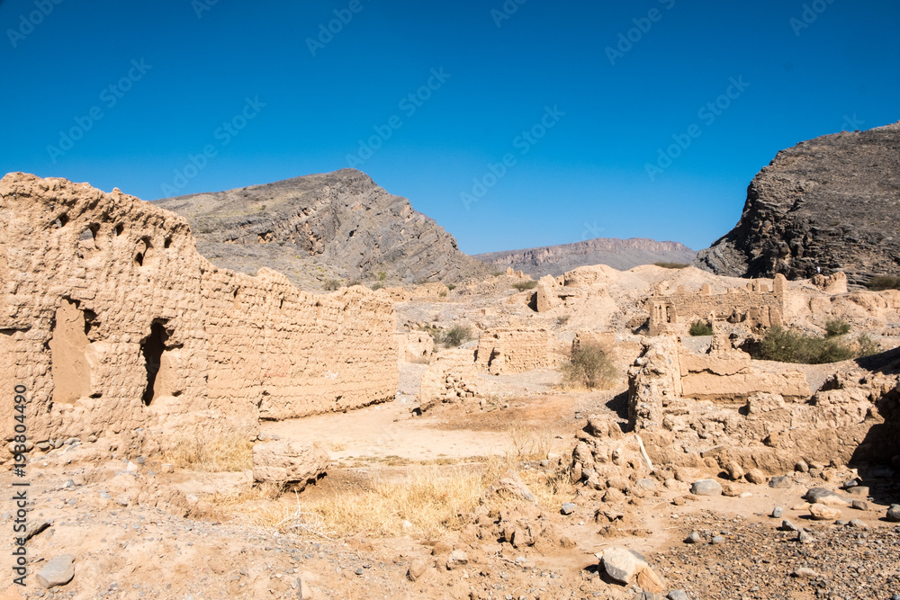Tanuf, Sultanate of Oman is a village placed almost half-way between the cities Nizwa and Bahla. It is famous for its historical ruins of the old village. Tanuf, Sultanate of Oman is a village placed almost half-way between the cities Nizwa and Bahla. It is famous for its historical ruins of the old village.