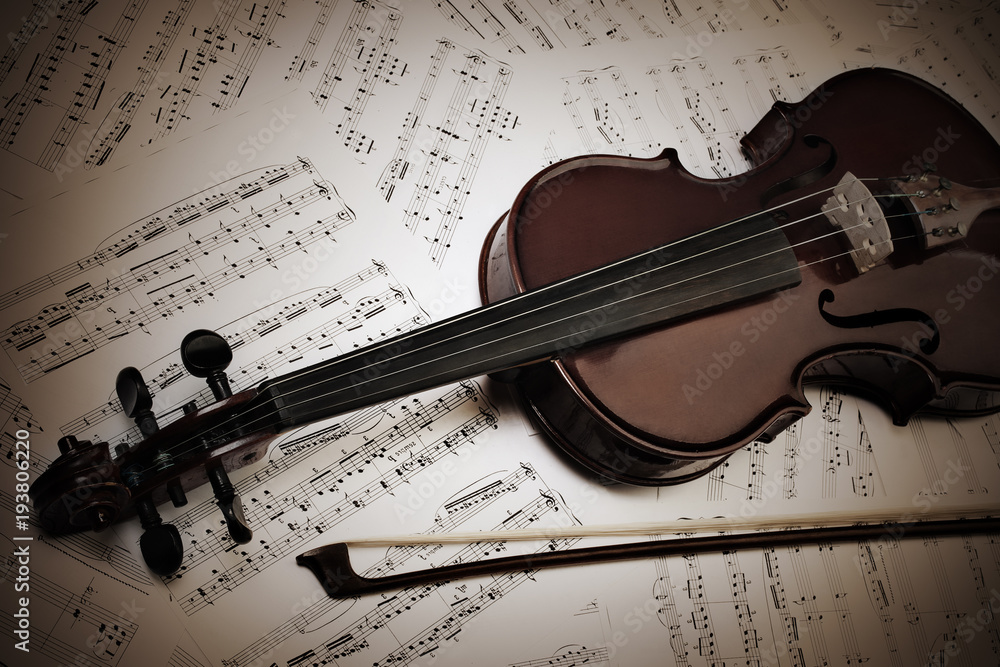 Fototapeta premium Violin and bow with music sheet notes