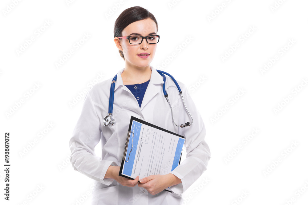 Young woman doctor with stethoscope holding clipboard in her hands in white uniform on white background Young woman doctor with stethoscope holding clipboard in her hands in white uniform on white background