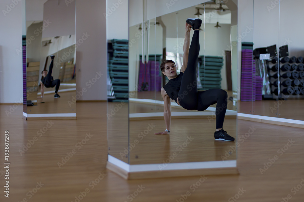 the woman in a gym doing exercises the woman in a gym doing exercises