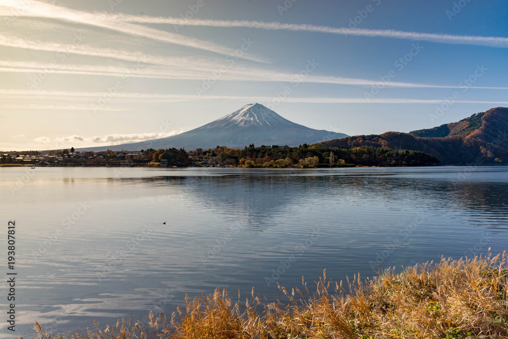 Fuji mountain reflecting its shadow in kawaguchiko lake in the morning light with skyline