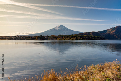 Fuji mountain reflecting its shadow in kawaguchiko lake in the morning light with skyline