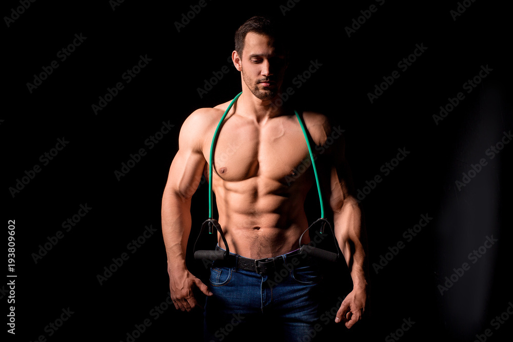 Fitness concept. Muscular and sexy torso of young man having perfect abs, bicep and chest. Male hunk with athletic body. Fitness concept. Muscular and sexy torso of young man having perfect abs, bicep and chest. Male hunk with athletic body.