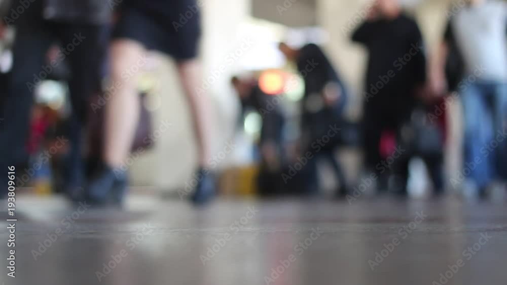 Many people walk around the shopping center and train station. Many people walk around the shopping center and train station.