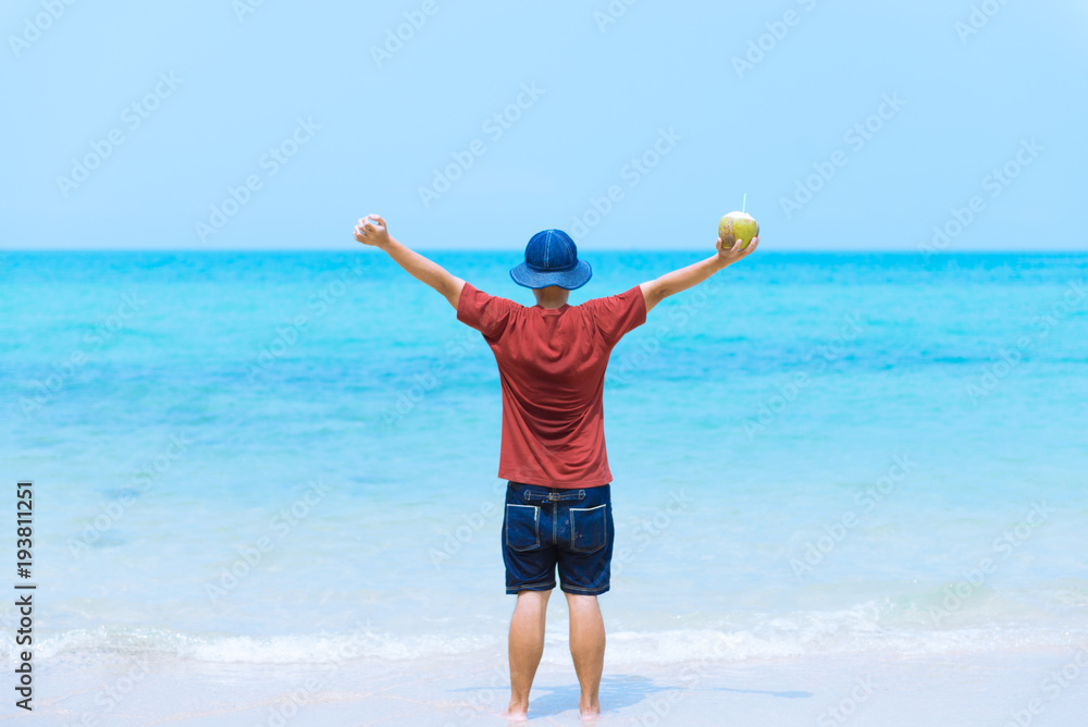 Man is enjoy traveling alone on the beautiful beach during vacation summer time. Man is enjoy traveling alone on the beautiful beach during vacation summer time.