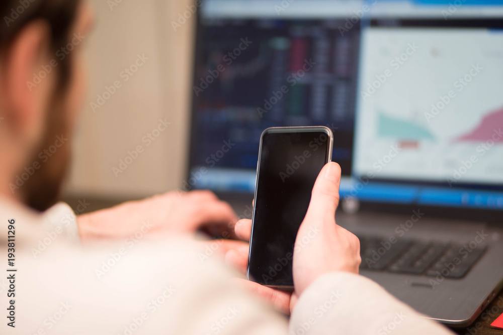 Businessman checking his stocks Businessman checking his stocks