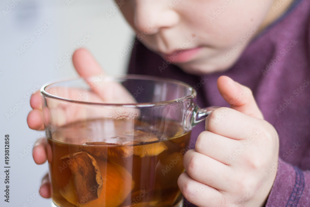Little kid drinking healthy sugarfree non-allergic natural dried apple drink, home made Little kid drinking healthy sugarfree non-allergic natural dried apple drink, home made