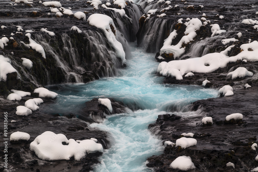 Blue Bruarfoss waterfall in winter in Iceland Blue Bruarfoss waterfall in winter in Iceland