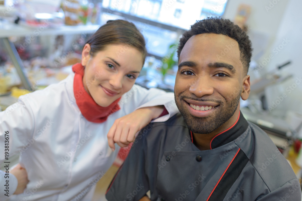 crew of professional cooks working at restaurant kitchen crew of professional cooks working at restaurant kitchen