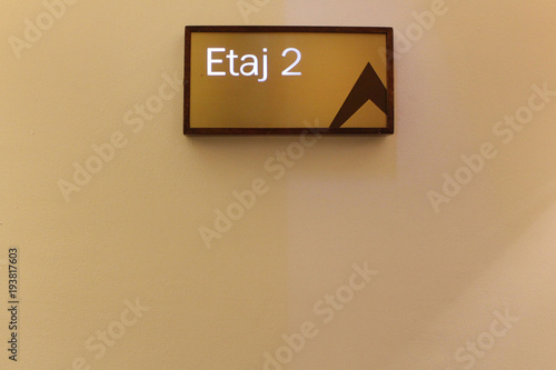 Sign 2 in elevator. arrow with number 2 in lift on the wall. Background second floor. Copy space.   photo