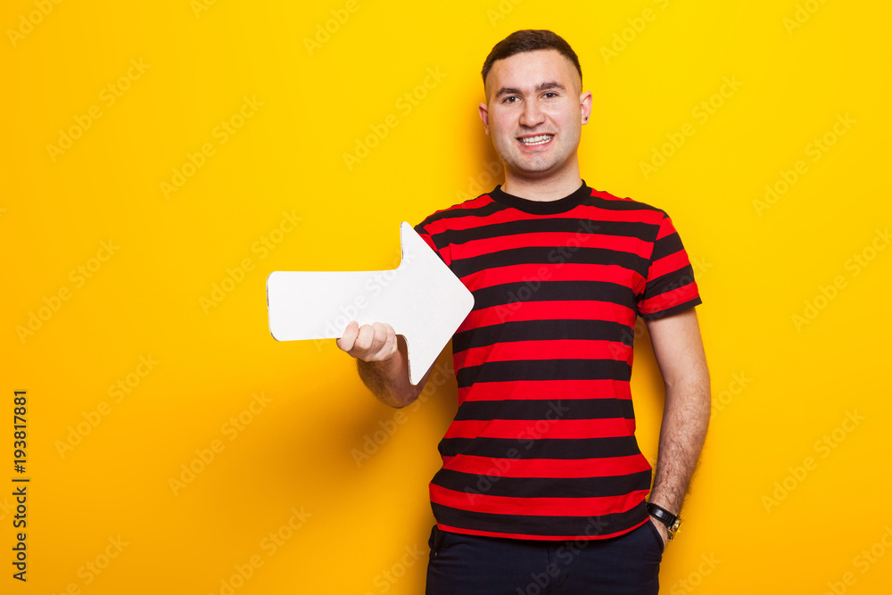 Handsome man in bright T-shirt with speech pointer Handsome man in bright T-shirt with speech pointer