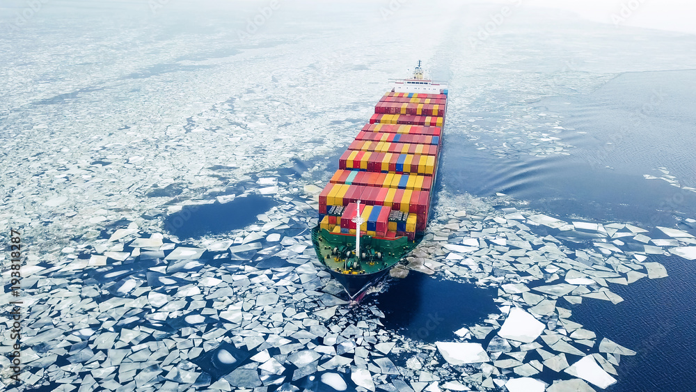 Aerial view of container ship in the sea at winter time - obrazy, fototapety, plakaty 