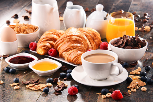 Breakfast served with coffee, juice, croissants and fruits