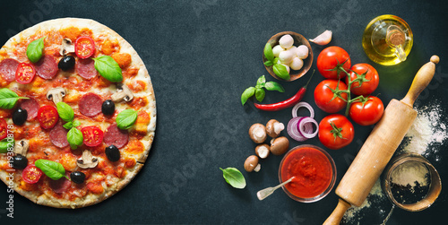 Delicious pizza with ingredients and spices