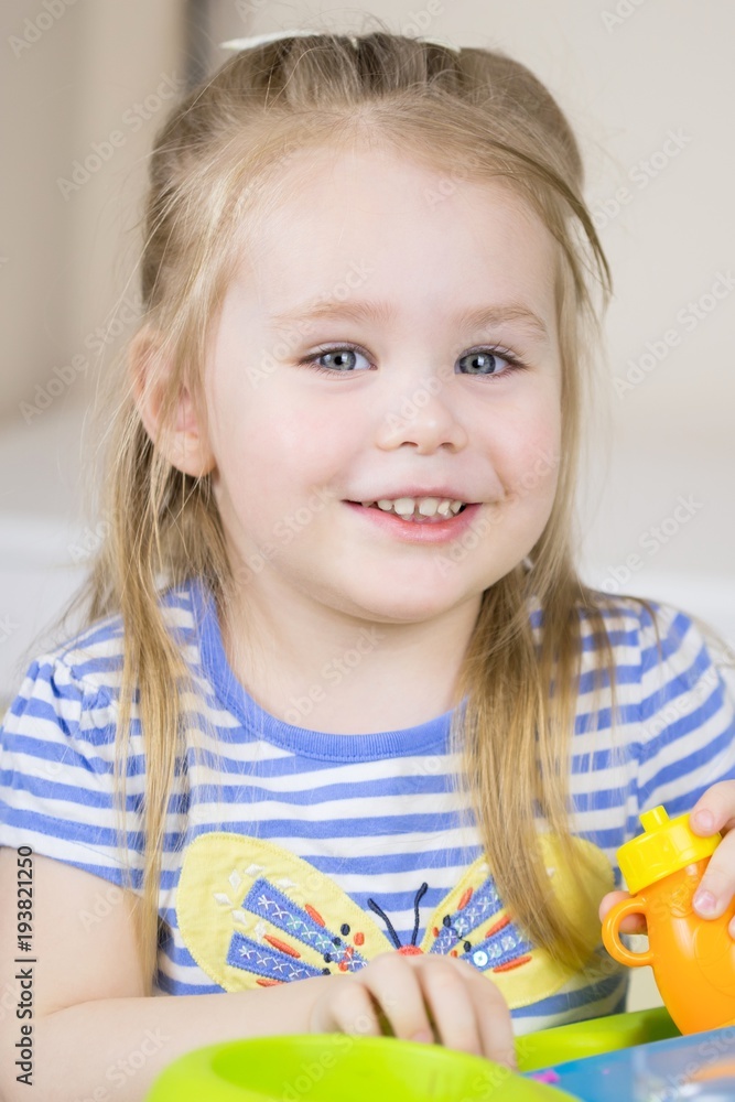 Cute little girl playing and having fun with clay, plastiline Cute little girl playing and having fun with clay, plastiline