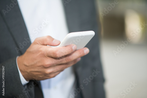 Businessman using his phone