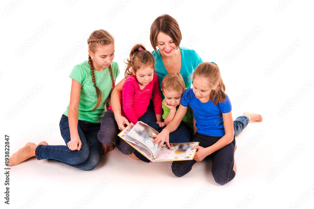 Mother reading a book to children isolated Mother reading a book to children isolated