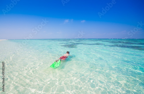 Maldives, man snorkeling!