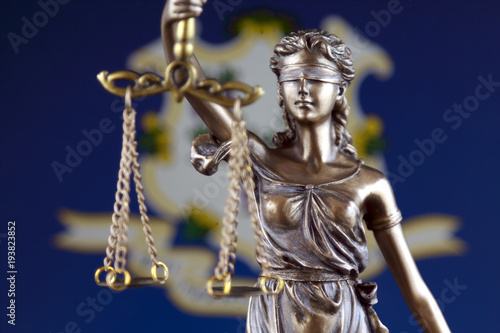Symbol of law and justice with Connecticut State Flag. Close up.