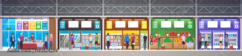 Supermarket store with goods. Mall Interior. Big shopping center. Interior store inside. People in line at cash desk. Scene inside shopping mall. 
